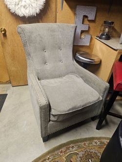 Chair beautiful gray it's ripped you can probably get it fixed I'm sure it's really pretty great decor