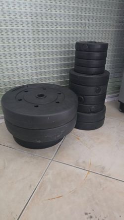 Set of weights with barbell and dumbells