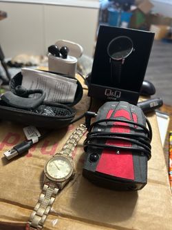 Assorted of ear buds ,new radar detector and ladies watches