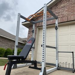 power rack  and adjustable bench (comes with weight and kettlebells  storage racks )