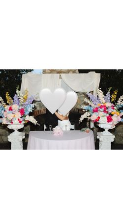 Faux flower arrangement and pilars for events