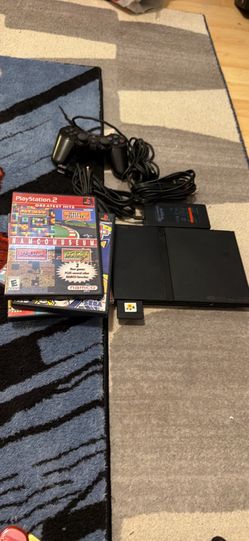 PlayStation 2 slim with 5 games, controller and memory card,  games are Namco Museum, volume three Activision classic games, Tetris worlds sonic plus 