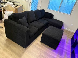 Brand new black sectionals with free ottoman