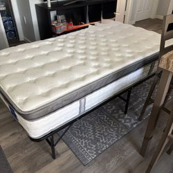 Twin Size Mattress With Black Bed Bar Set Up 