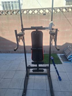 Pull up bar with folding bench