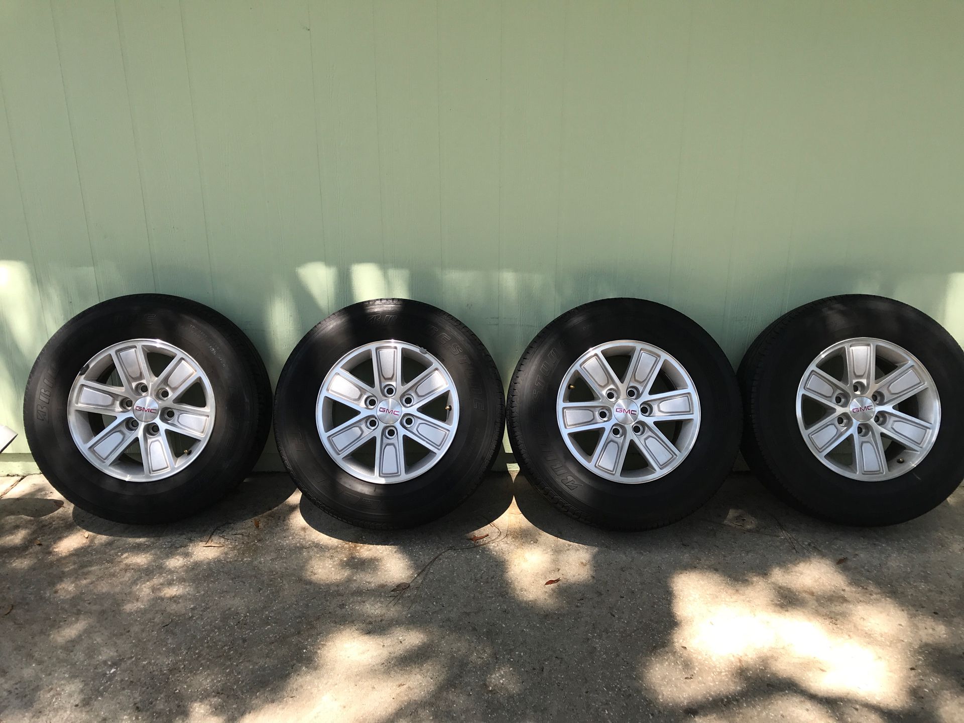 4stock gmc rims and tires 6 lug plus spare and lug nuts