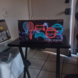 A joycon sports kit/with tennis rackets controllers wheels