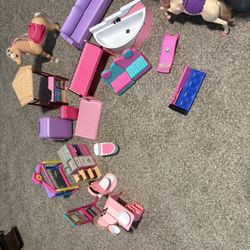 Three Barbie dolls, and all their accessories