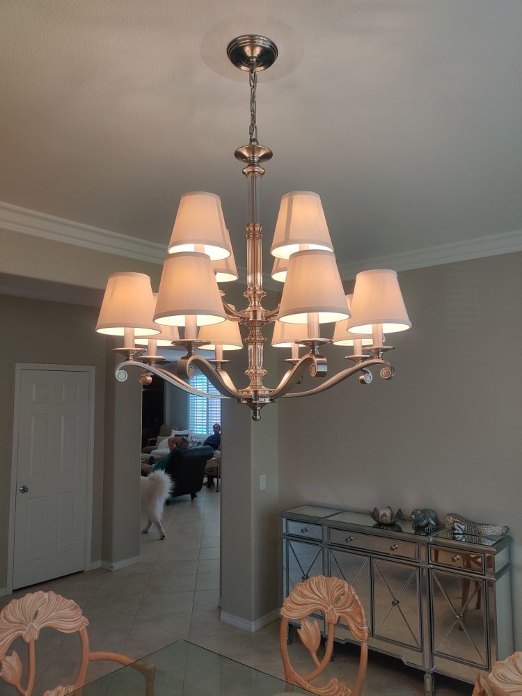 New, In Original Box. Chandelier with glass center