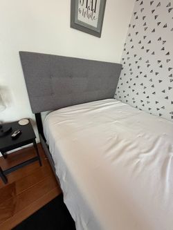 Gray padded queen bedframe