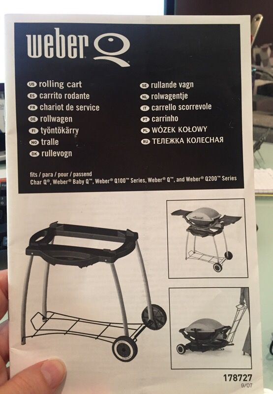 Weber grill with stand and cover.