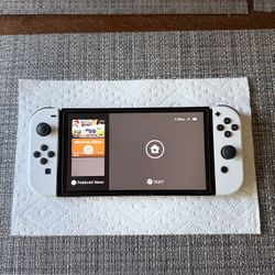 OLED Nintendo Switch W/ Super Smash Bros.
