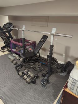 Rack And 300 Pound Weights And Bar