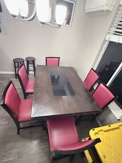 Dark Wood Dining Table with 6 Pink Chairs