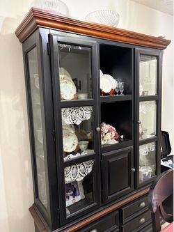 China cabinet with antique China plates