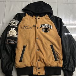 The jacket shown is a Champion Super Fleece varsity jacket with black leather sleeves. 