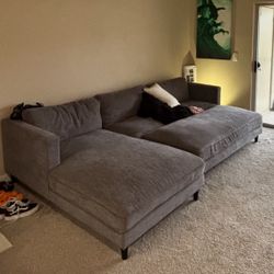 Living Spaces dark gray couch w/ ottoman
