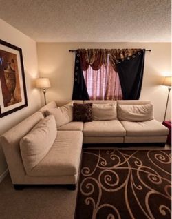 beige sectional L shaped couch