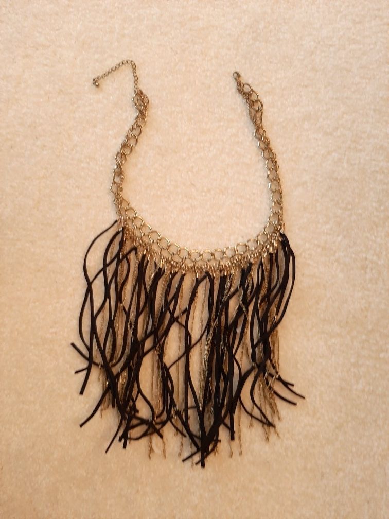 Black Leather fringe necklace with gold tone strands.
