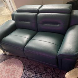 Like New,,8 Month Old,, Castella Leather Dual Power Reclining Loveseat Color Teal $900.00 O.B.O.