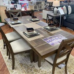 Moriville Grayish Brown Extendable Dining Set Table And Chairs 