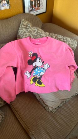 Disney Minnie Mouse crewneck sweatshirt features a graphic of Minnie