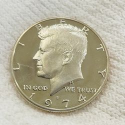 This set includes Two 1974 Proof Jfk Half Dollars And Two 2022 almost uncirculated JFK half dollars