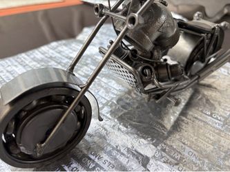 motorcycle sculpture made from repurposed scrap metal