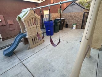 Kids play set with swings and slide
