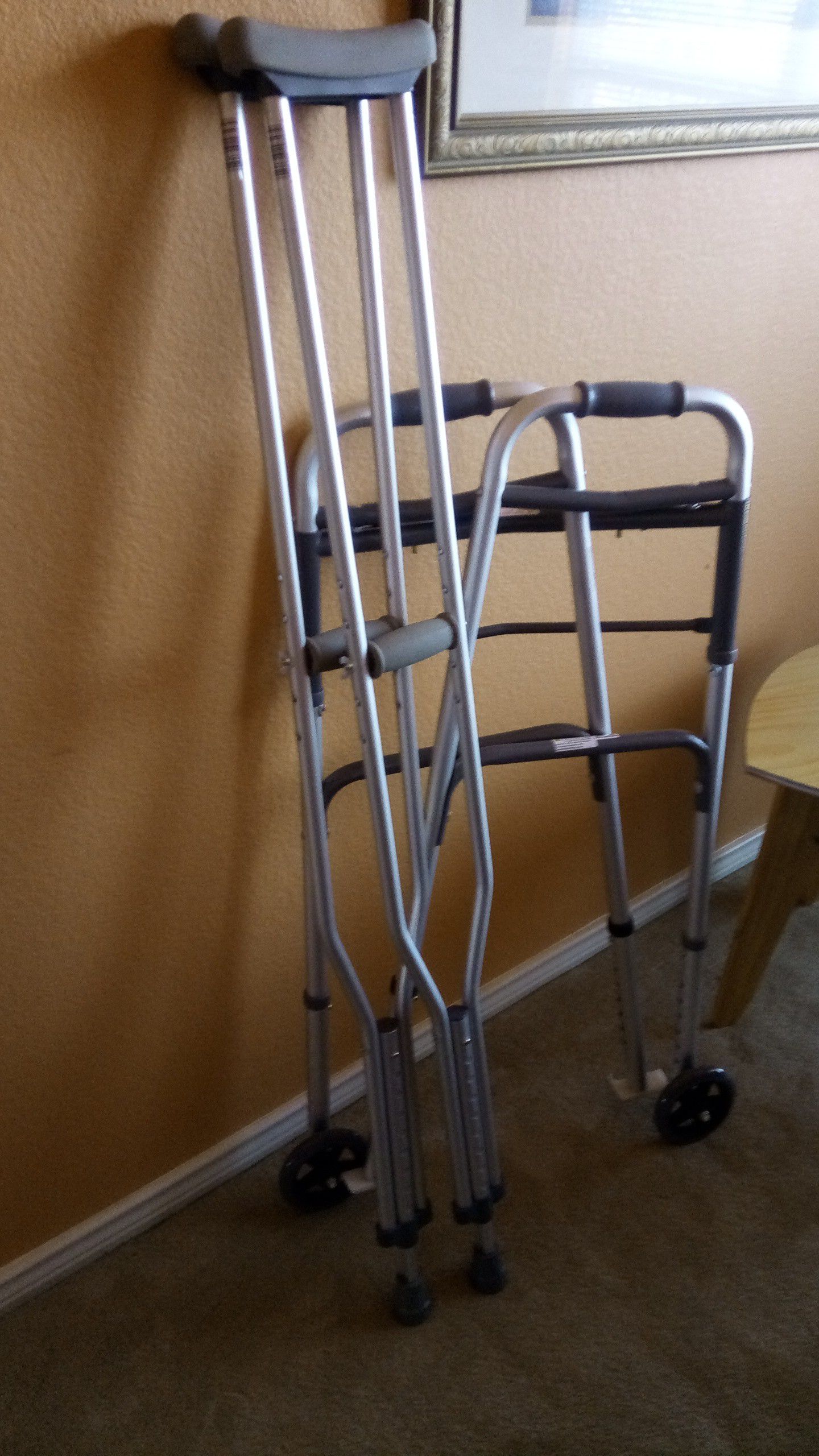 Walker with glides and crutches. Height adjustable