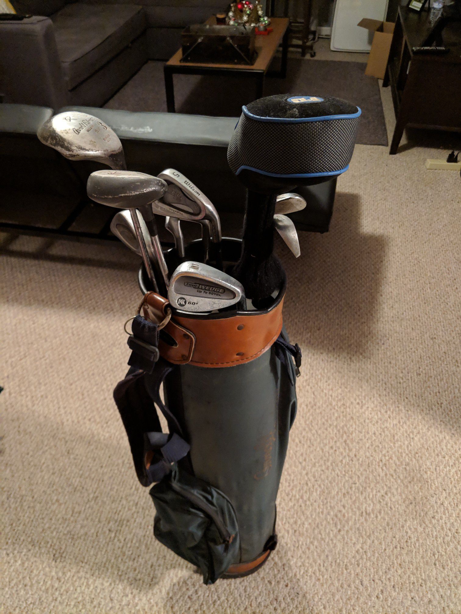 Arnold palmer golf bag with misc. clubs