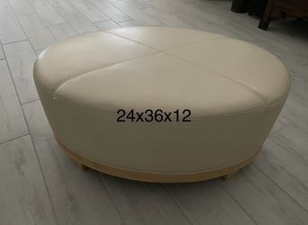 Cream Colored Vinyl Ottoman