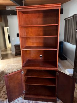 The Bombay Company traditional mahogany finish bookcase/display hutch and matching base cabinet