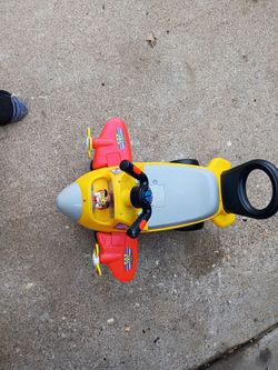 Toddlers riding airplane