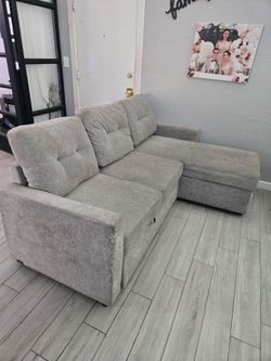 Reversible storage sectional sofa bed.