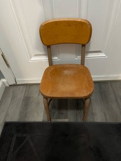 Vintage Very old Heywood Wakefield Child's Chair Solid Wood & Metal.  Size approximately 12 inches wide and 22 inches tall .  The chair has one crack 