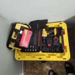 Drill Gun With All The Bit And Fits Also A Tool Bag And Gloves Along With A Socket Set  
