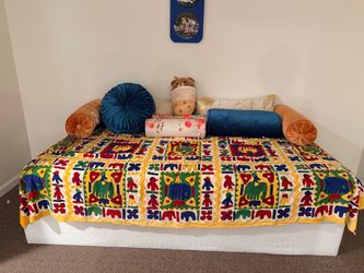Colorful upholstered daybed / bench with cushions