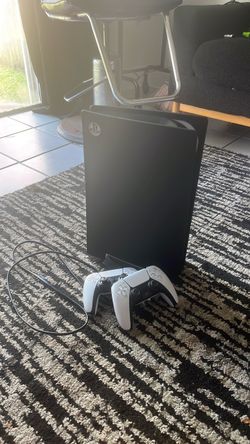 PlayStation 5 with 2 controllers and cord