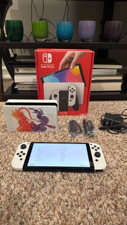 Nintendo Switch OLED model with Pokémon scarlet and violet edition dock