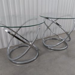 2 Beautiful Chrome/Glass Tables, $50. 26" wide, 22" tall