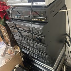 Pile Of Subwoofers Receivers Speakers 