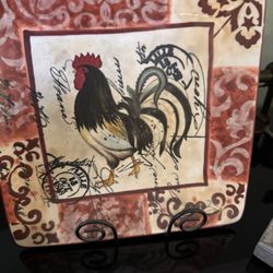This is a Certified International Lille Rooster square dinner plate, designed by Geoff Allen. 