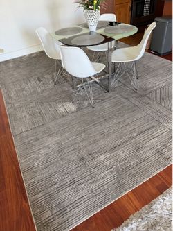 Pinstriped rug with a premium rug pad 9’*12’