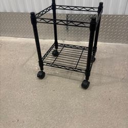Metal stand on four wheels $20