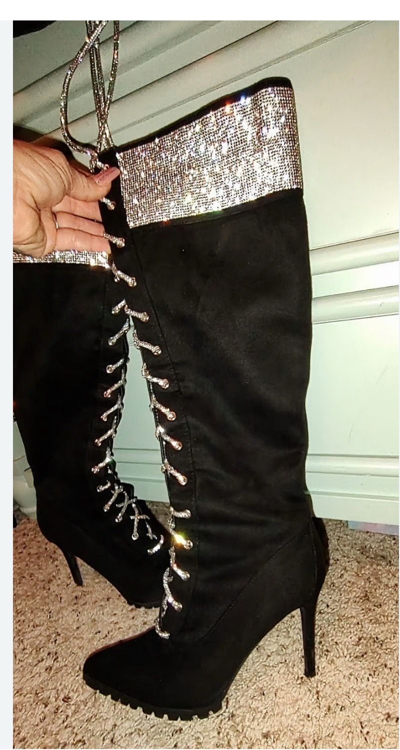 Black stiletto boots featuring rhinestones and lace-up