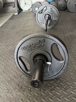Olympic curling bar with 25 pound plates