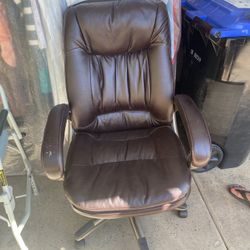 Recliner Chair - Burgundy In Colour.