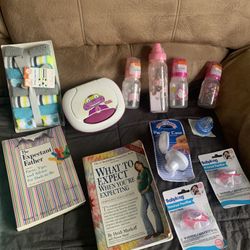 Collection Of Baby Items- New Bottles, Pacifiers, Wash clothes, 2 Books And A Holder For Wipes 