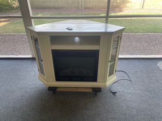 Flat wall or corner  entertainment center with built-in fireplace pick up only. Cross streets 59th Ave. and Peoria.